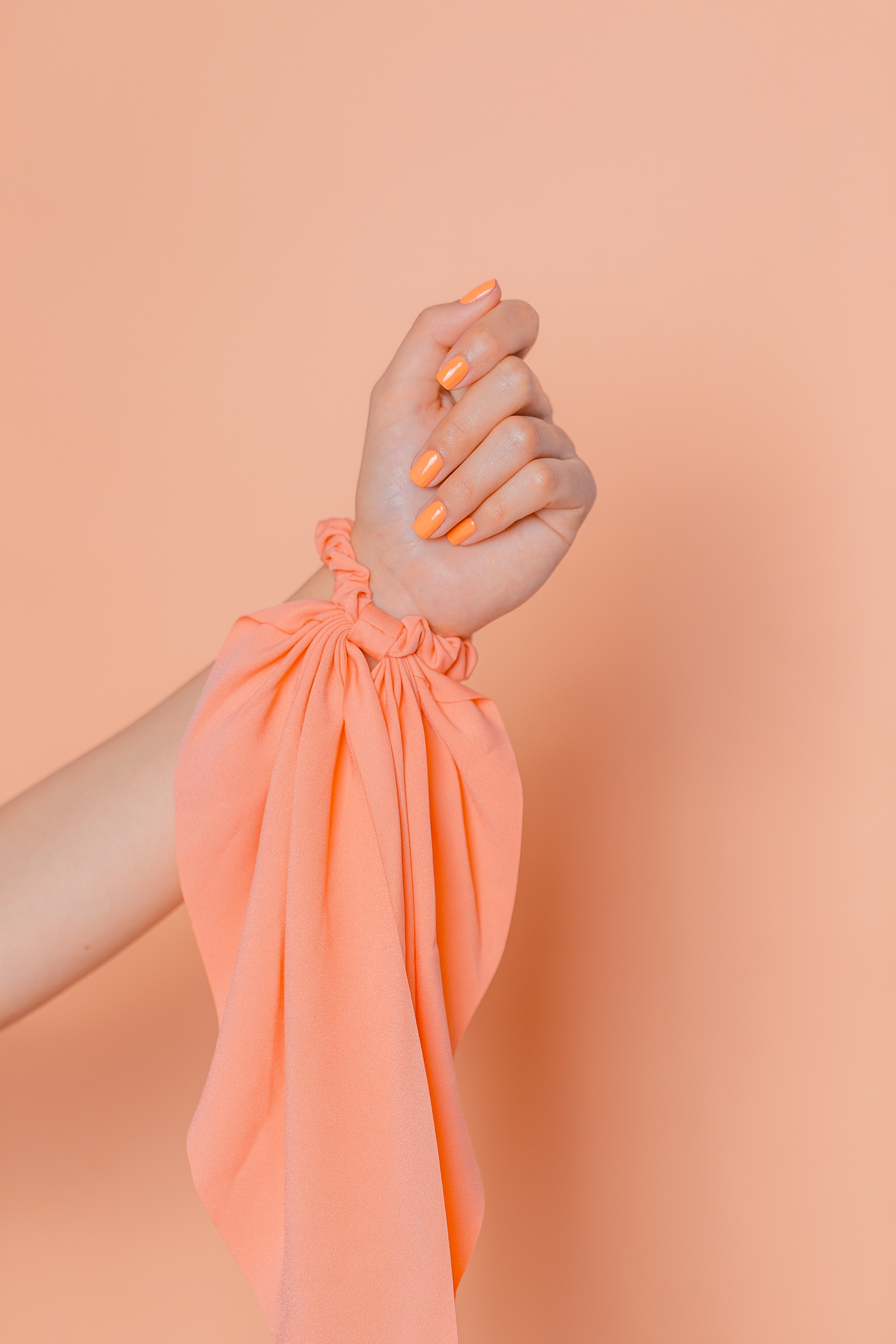 Hand with an Orange Scarf